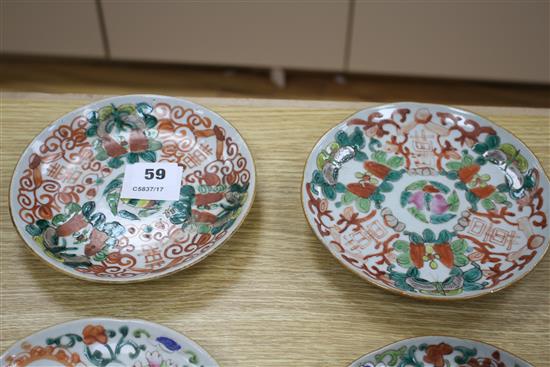 A near set of six 19th century Chinese famille rose saucer dishes, each painted with fruit and shou characters, diameter ranging 16.3cm